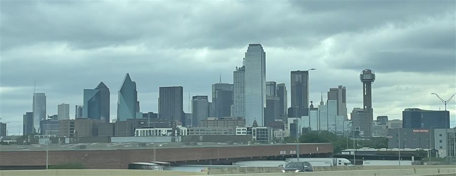 Dallas skyline or streetscape, recognizable, tasteful, daytime